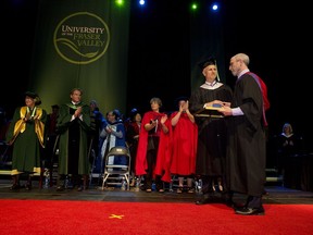 ABBOTSFORD, B.C.: JUNE 6, 2017 – Transit Police Chief Doug LePard is pictured second from right (foreground) at the convocation ceremony for the University of the Fraser Valley out in Abbotsford, B.C. on Tuesday, June 6, 2017. LePard graduated Tuesday with a master of art in criminal justice, after completing a 20-month part-time masters program. He also received the Governor General's Gold Medal for his near-perfect 4.23 grade point average. [PNG Merlin Archive]