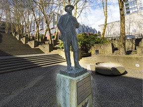 A statue of Sir Matthew Baillie Begbie stands outside the New Westminster Law Courts.