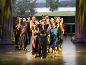 An unmasked Lois Anderson (portraying Paulina) leads a masked chorus line in Bard on the Beach’s production of The Winter’s Tale.