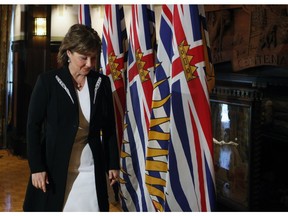 Premier Christy Clark leaves the podium after speaking to media following a swearing-in ceremony for the provincial cabinet at Government House in Victoria on Monday, June 12, 2017.