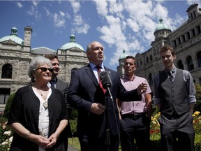 B.C. NDP leader John Horgan speaks to media as he's joined by (from left to right), Leslie McBain, Rob Fleming, Jason Gammon and Jacob Gair during a press conference from the Rose Garden at B.C. Legislature in Victoria, B.C., on Monday, June 26, 2017.