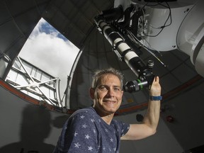 Howard Trottier is a professor of physics at Simon Fraser University, where he is pictured at the Trottier Observatory and Science Courtyard.
