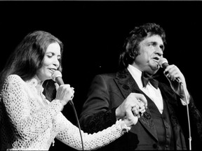 Johnny Cash and June Carter on stage at Pacific Coliseum in 1978.