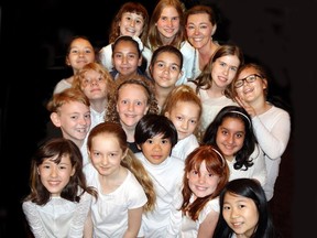 Catherine Campolin, top right, conducted the Henry Hudson Elementary intermediate choir through O Canada and This Is My Home at a Canadian Club luncheon for Order of Canada and Order of B.C. members.