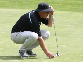 Doug Morgan lines up a putt at the B.C. Seniors' Championships at Salmon Arm Golf Club on Tuesday. ERIC MACKENZIE/PGA of BC [PNG Merlin Archive]