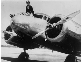 Feb. 1937. Amelia Earhart and her Lockheed Electra 10-E aircraft. This is not the plane that she flew in across the Atlantic.