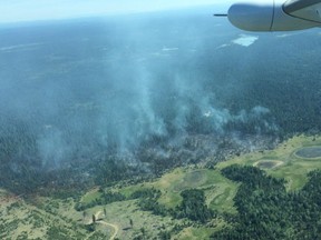 A wildfire burns near 100 Mile House in the photo taken June 23.