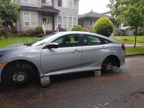 A Kitsilano woman shared photos of her 2016 Honda Civic after thieves stole two of its tires.