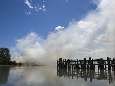 A fire burns on Mitchell island, Richmond, June 16 2017.