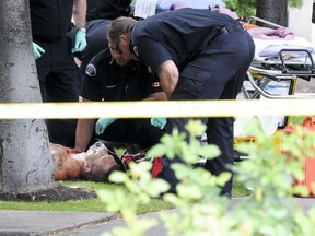 Paramedics tend to victim Larry Amero.