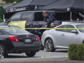 Langley RCMP and IHIT investigators at the scene of a fatal overnight shooting at the Browns Social House on 200th Street in Langley, BC, Saturday, June 10, 2017. One man was killed and another taken to hospital.