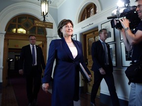 Premier Christy Clark makes her way to question period in the legislative assembly following a caucus meeting before the confidence vote at B.C. Legislature in Victoria on Thursday.