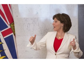 B.C. Premier Christy Clark, insisting the NDP-Green alliance won't work, gives the thumbs up before addressing a gathering in Vancouver on June 21.