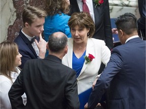 B.C. Premier Christy Clark speaks with colleagues before the speech from throne in Victoria on Thursday, June 22, 2017.