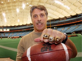 Lui Passaglia with his three Grey Cup rings in 2003.