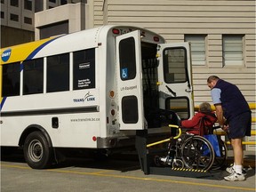 This file photo shows HandyDART users boarding a bus in front of Vancouver General Hospital.