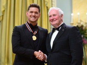 Governor General David Johnston presents Michael Buble with the National Arts Centre Award during the Governor General's Performing Arts Awards ceremony at Rideau Hall in Ottawa on Wednesday, June 28, 2017.