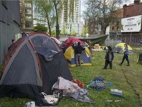 Homeless advocates and the homeless erect tents in a spare lot on main Street in Vancouver, BC Friday, April 28, 2017 to draw attention to the plight of homelessness.