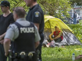Maple Ridge fire and RCMP  check on the situation at Anita Place homeless camp on 223rd Street in Maple Ridge, Tuesday, May 2, 2017 to ensure the safety of the campers.