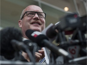 Finance Minister and Liberal House Leader Mike de Jong addresses the media in Vancouver on Thursday.