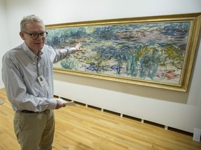 Ian Thom, a senior curator at the Vancouver Art Gallery, leads a tour of the new exhibition Claude Monet's Secret Garden on Thursday. ‘Although the exhibition was to be focused mostly on paintings at Giverny, we wanted a group of paintings that would lead up to that,’ he says.