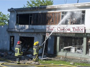 Vancouver firefighters put out hot spots Friday morning, June 23, 2017 on several buildings that caught fire late Thursday at W. 41st Avenue and Maple Street.