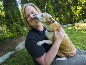 Kathy Powelson, with Skippy, at their home in Maple Ridge on May 29. She is executive director of the Paws for Hope Animal Foundation. Powelson is calling on Vancouver to follow neighbouring municipalities in creating a bylaw that would prohibit the sale of certain pets at stores.