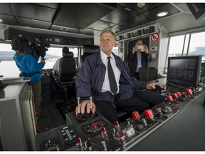 Joe Lutz, who is the only remaining captain left since the SeaBus opened in 1977, poses for a photo on the new Burrard Otter II SeaBus between the North Shore and Vancouver.