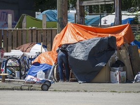 A judge has reluctantly ordered about 50 homeless who have been camping on a city-owned lot at 950 Main Street in Vancouver designated for social housing to vacate the premises by Wednesday.