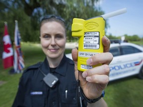 VPD constable Andrea Anderson holds a Alco-Sensor FST Approved Screening Device, also-known-as a breathalyzer, that will be deployed during a province-wide summer counter-attack enforcement program.