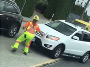 Charges have been laid after a white SUV struck two flaggers in Burnaby two weeks ago, seriously injuring one. This is a screengrab from a Reddit video that shows a Burnaby flagger being run over by a Hyundai SUV.