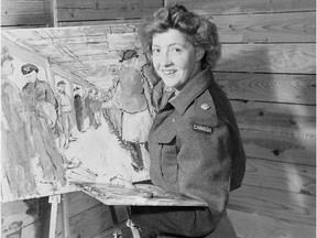 Second Lieutenant Molly Lamb of the Canadian Women's Army Corps, a war artist, works on a painting in London in 1945.
