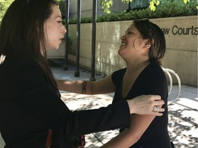 Phillip Tallio's lawyer Rachel Barsky (left) and Phillip Tallio's daughter, Honey Hood, embrace after a B.C. Court of Appeal judge said Tallio can appeal his 1983 murder conviction, decades after the normal deadline to file an appeal had passed.