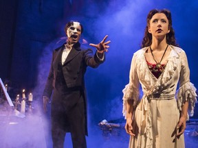 Derrick Davis (as The Phantom) confronts Katie Travis (as Christine Daaé) in his underground sanctuary in the new production of The Phantom of the Opera.