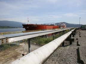 A pipeline at the Westridge Marine Terminal in Burnaby, with an oil tanker in dock on Burrard Inlet.