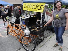 Erin Slobogian shows off the Beer B trike at the Velopalooza booth on Commercial Drive during 2011 Car Free Day.