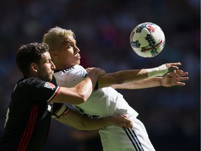 Fredy Montero traps the ball while pressured by DC United's Steve Birnbaum in an MLS game at B.C. Place on May 27, 2017.