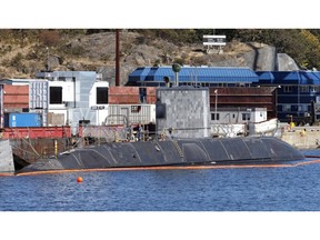 One of Canada's four submarines has been hit by another naval vessel while docked at CFB Esquimalt in British Columbia. A naval spokesman says HMCS Chicoutimi was docked in the harbour when an Orca-class training vessel that was heading out of sea rubbed up against it.