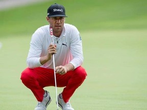 Graham Delaet, of Canada, lines up his birdie putt on the 17th green during the second round of the Canadian Open golf tournament at Glen Abbey Golf Club, in Oakville, Ont., Friday, July 28, 2017. THE CANADIAN PRESS/Frank Gunn