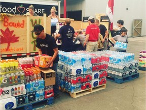 A group of Fort McMurray residents delivered a trailer loaded with donated water, food and supplies for wildfire evacuees and first responders in Kamloops on Monday.