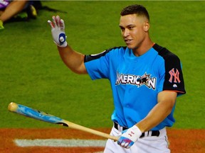 Aaron Judge of the New York Yankees acknowledges the cheers of fans during Major League’s Baseball’s Home Run Derby at Marlins Park in Miami, Fla., on Monday, part of the MLB All-Star Game festivities.