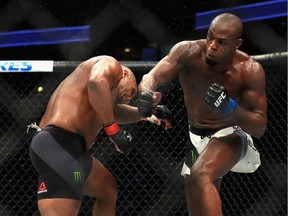 Daniel Cormier (L)  fights Jon Jones in the Light Heavyweight title bout  during UFC 214 at Honda Center on July 29, 2017 in Anaheim, California.