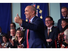 Premier John Horgan gives a thumbs up after giving an oath with Lieutenant-Governor Judith Guichon as he's sworn-in as Premier during a ceremony with his provincial cabinet at Government House in Victoria, B.C., on Tuesday, July 18, 2017.