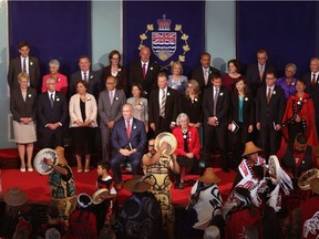 Premier John Horgan and Lieutenant-Governor Judith Guichon look on as the Lax Keen Traditional Tsimshian Dancers before being sworn-in as Premier during a ceremony with his provincial cabinet at Government House in Victoria, B.C., on Tuesday, July 18, 2017.