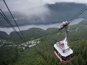 People ride on the Grouse Mountain Skyride in North Vancouver. Grouse Mountain Resorts officials say there will be no changes to staff, management or operations after the sale of the company.