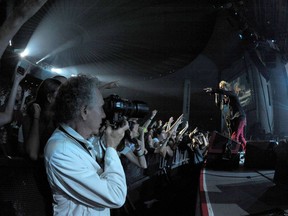 Photographer Bob Gruen at work in 2010.