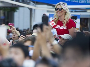 The crowd sings O Canada at the Canada Day celebrations at Canada Place, Vancouver, July 01 2017.