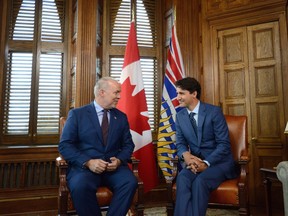 Prime Minister Justin Trudeau (right) meets with new B.C. Premier John Horgan in his office on Parliament Hill in Ottawa on Tuesday.