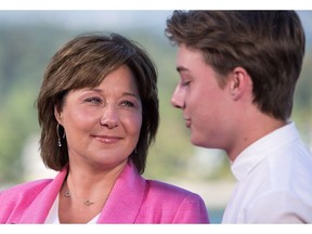 Former B.C. premier Christy Clark, with her son Hamish looking on, spoke to reporters on Monday for the first time since announcing she will be stepping down as B.C. Liberal leader and MLA.