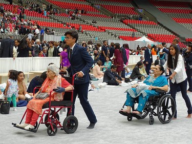 Seniors are wheeled to an accessible seating area on July 11. One of the values consistently emphasized by His Highness the Aga Khan has been the caring for the aging population.